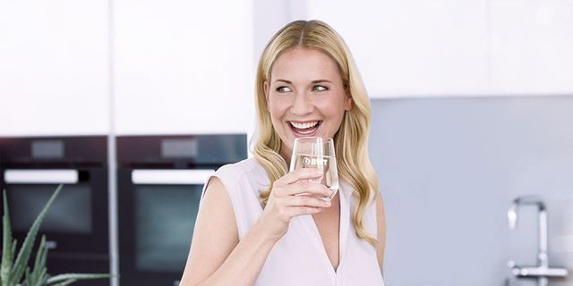 Woman enjoying a fresh glass of water