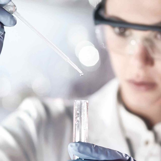 Female chemist analysing water
