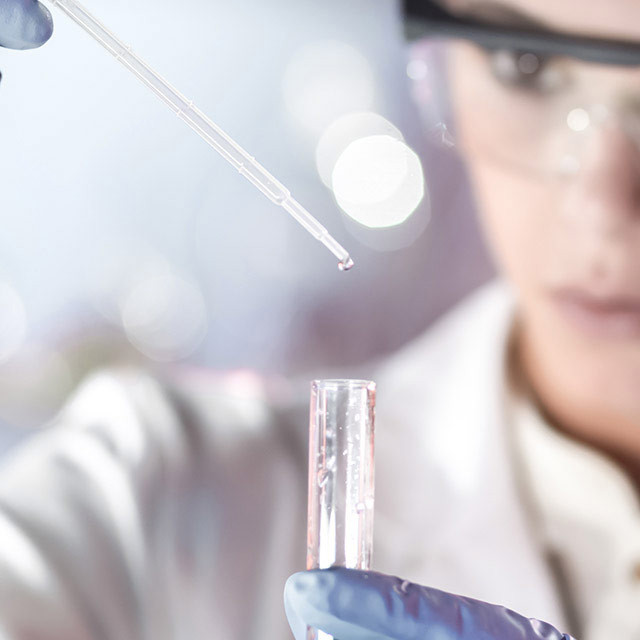 Female chemist analyzing purified water