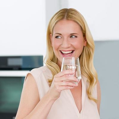 Woman enjoying a glass of mineralized water