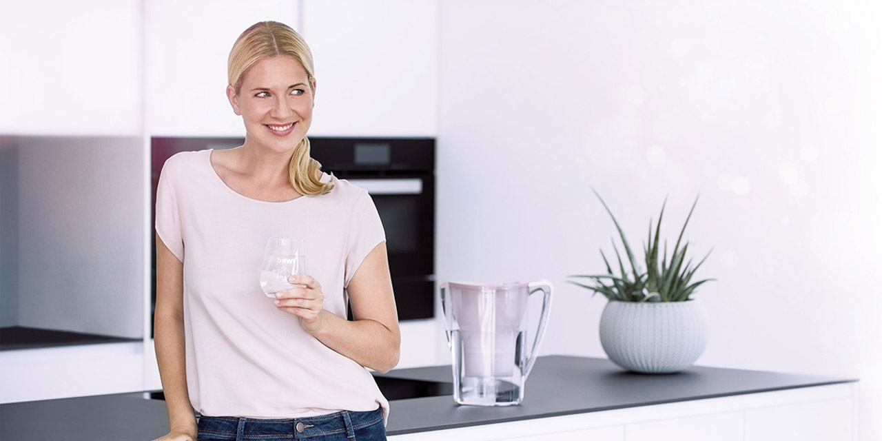 Woman enjoying a fresh glass of mineralized water