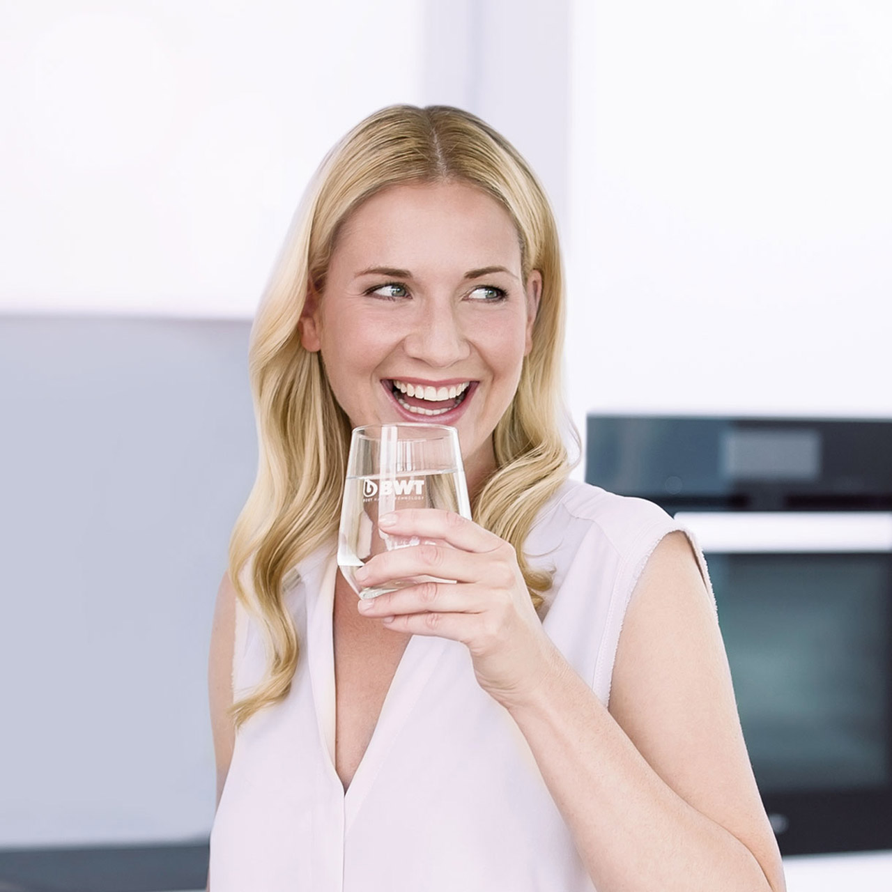 Woman enjoying a glass of mineralized water