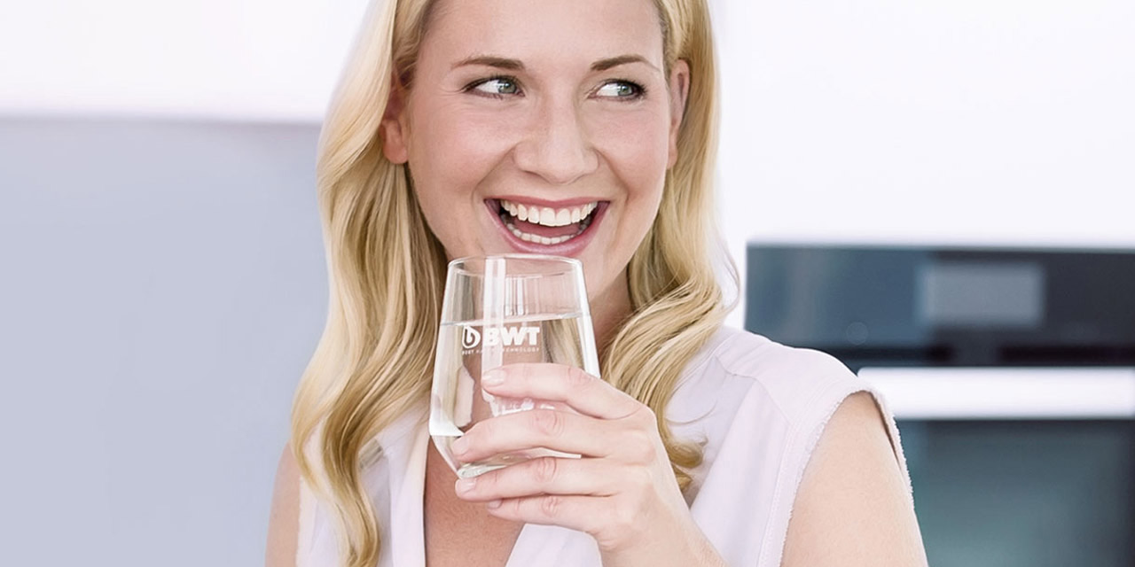 Woman enjoying a glass of fresh water