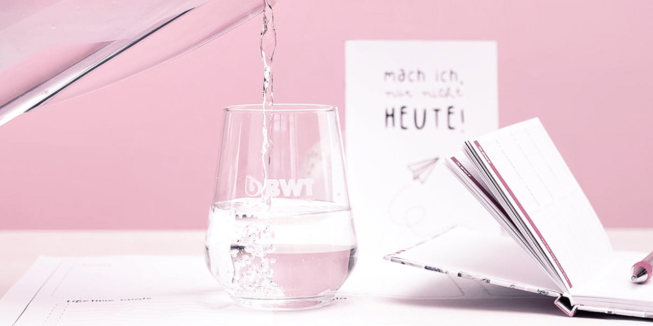 Pouring a glass of mineralized water